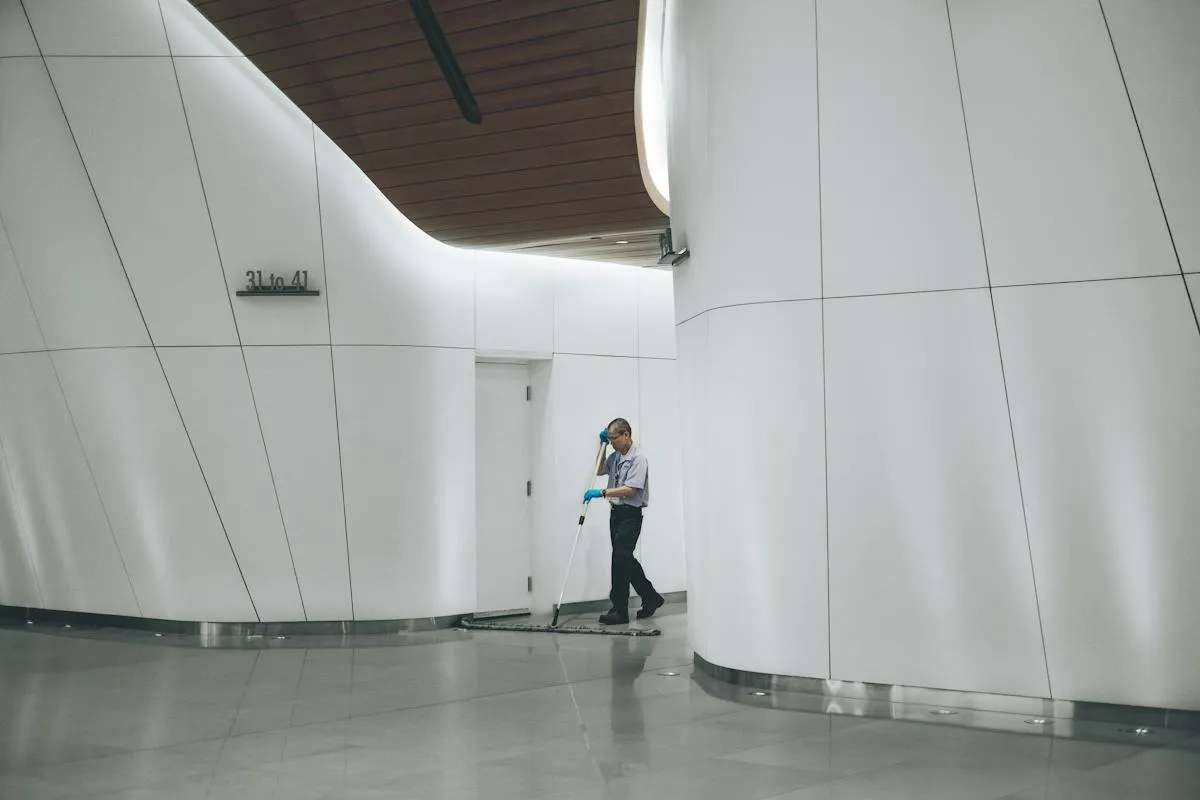 Professional mopping a spacious indoor floor