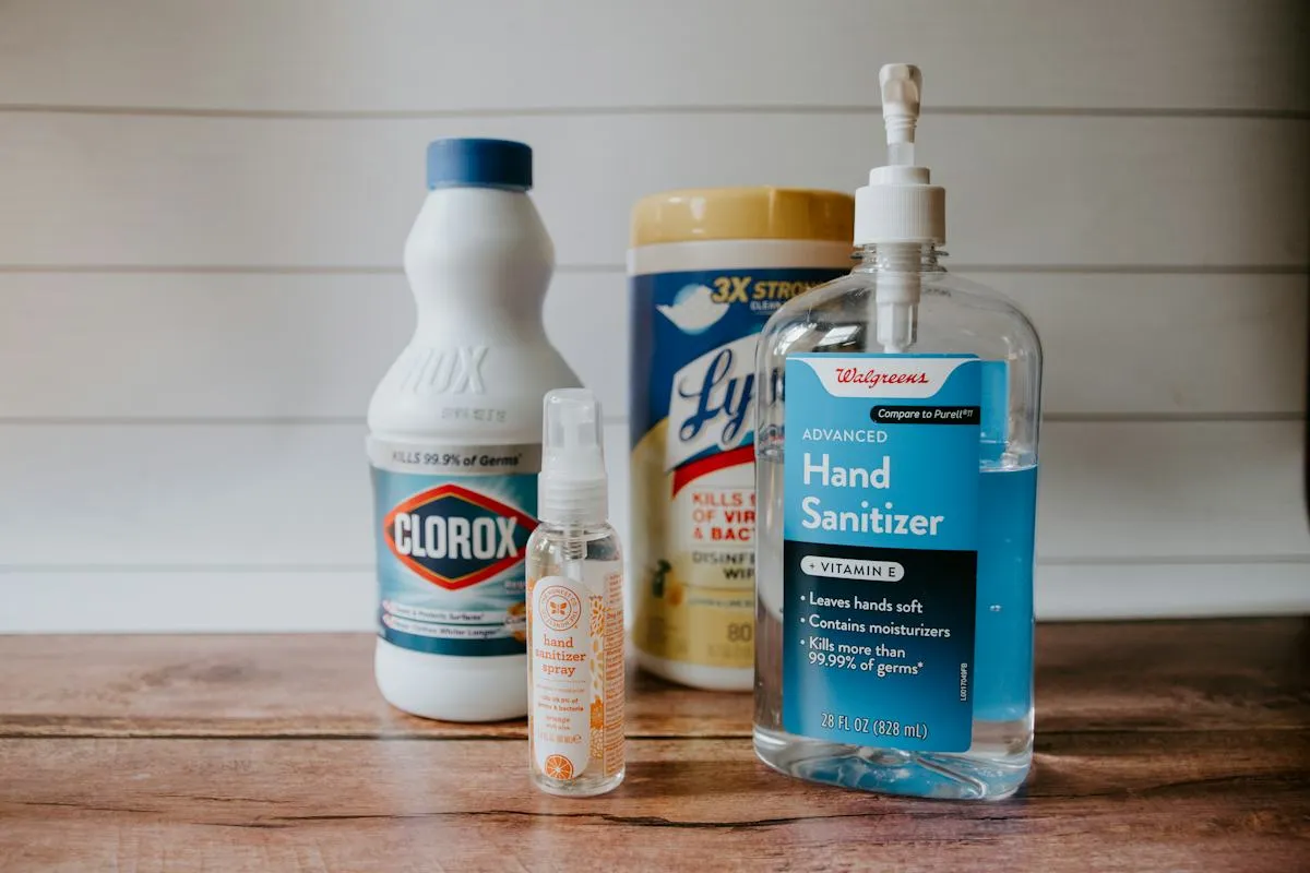Assortment of household cleaning products on a worktop