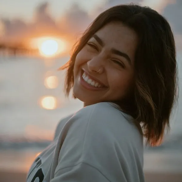 Smiling woman standing outside